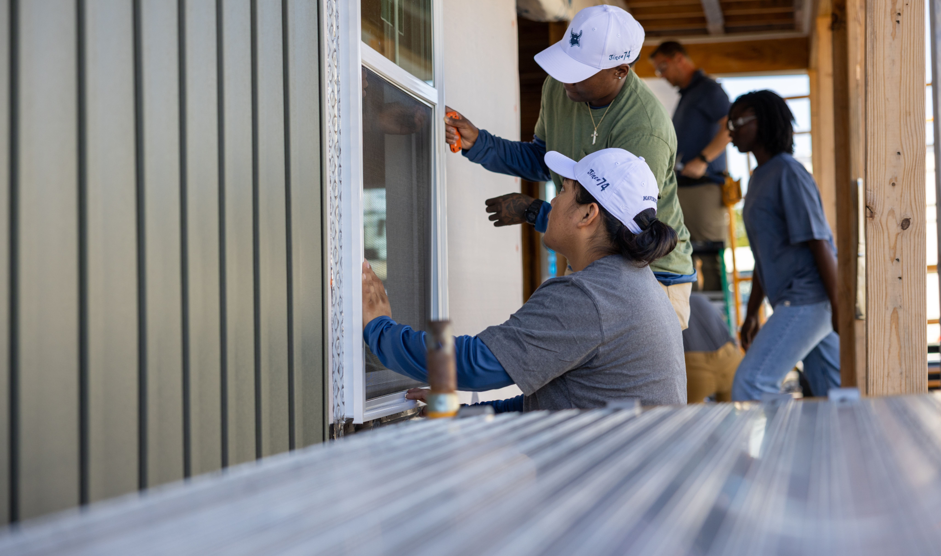 Workers working on a house that is being built